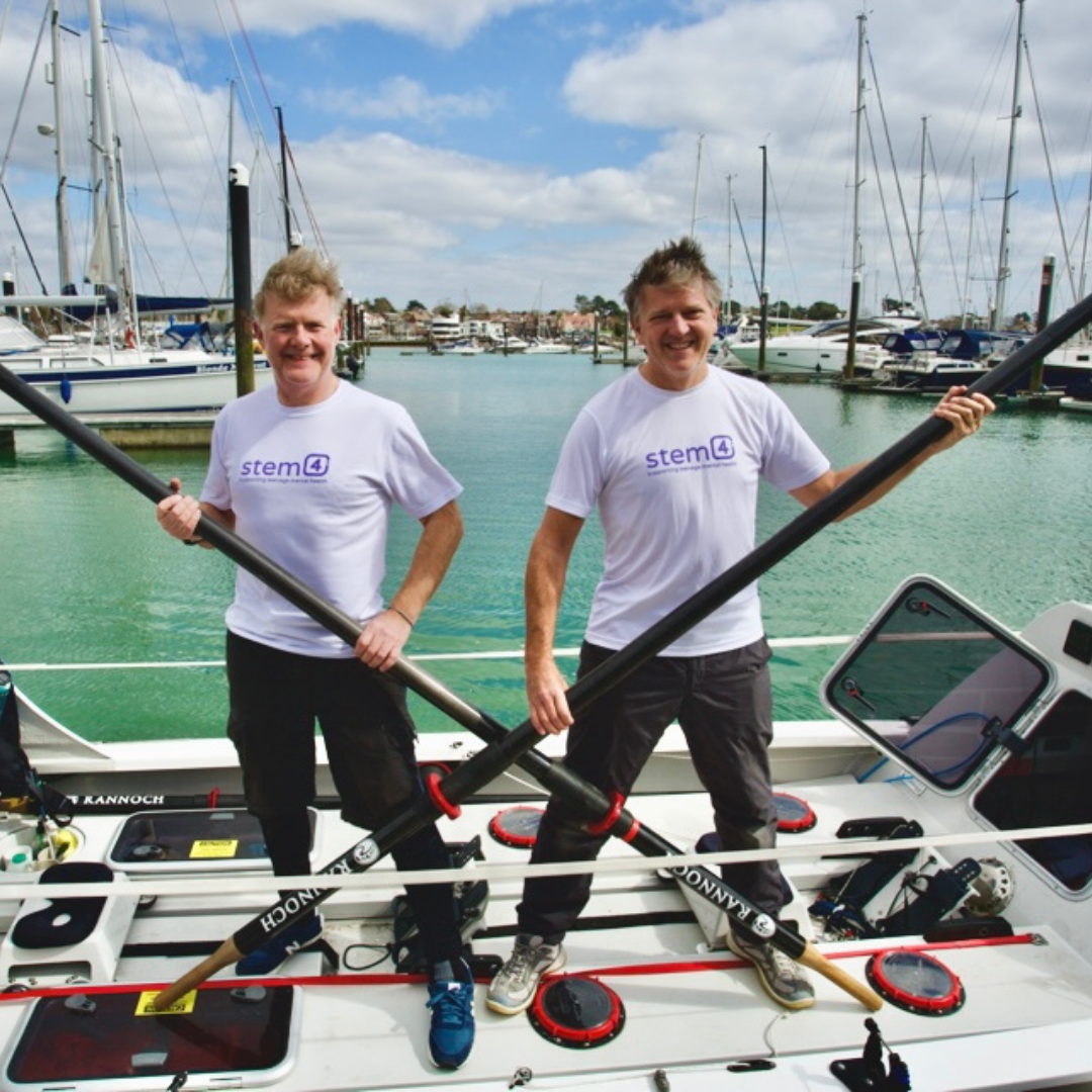 Simon and Tim Two men in boat holding oars